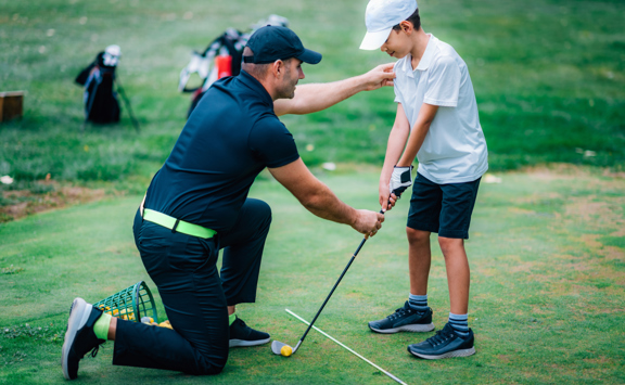 Golf Lessons Golf Instructor Giving Game Lesson Young Boy (2)