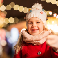Happy Girl With Sparkler Christmas Market